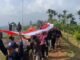 Pupuk Cinta Tanah Air dan Promosi Wisata, Desa Harapan Jaya Gelar Upacara 17 Agustus di Bukit Lantana